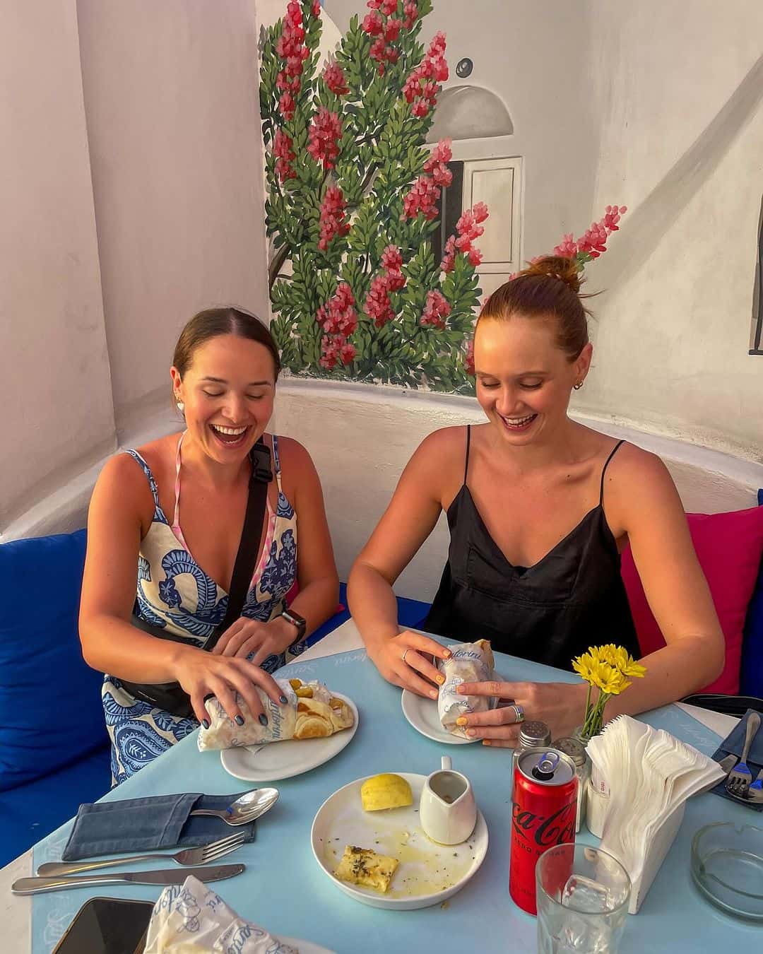 2 girls enjoying a meal together