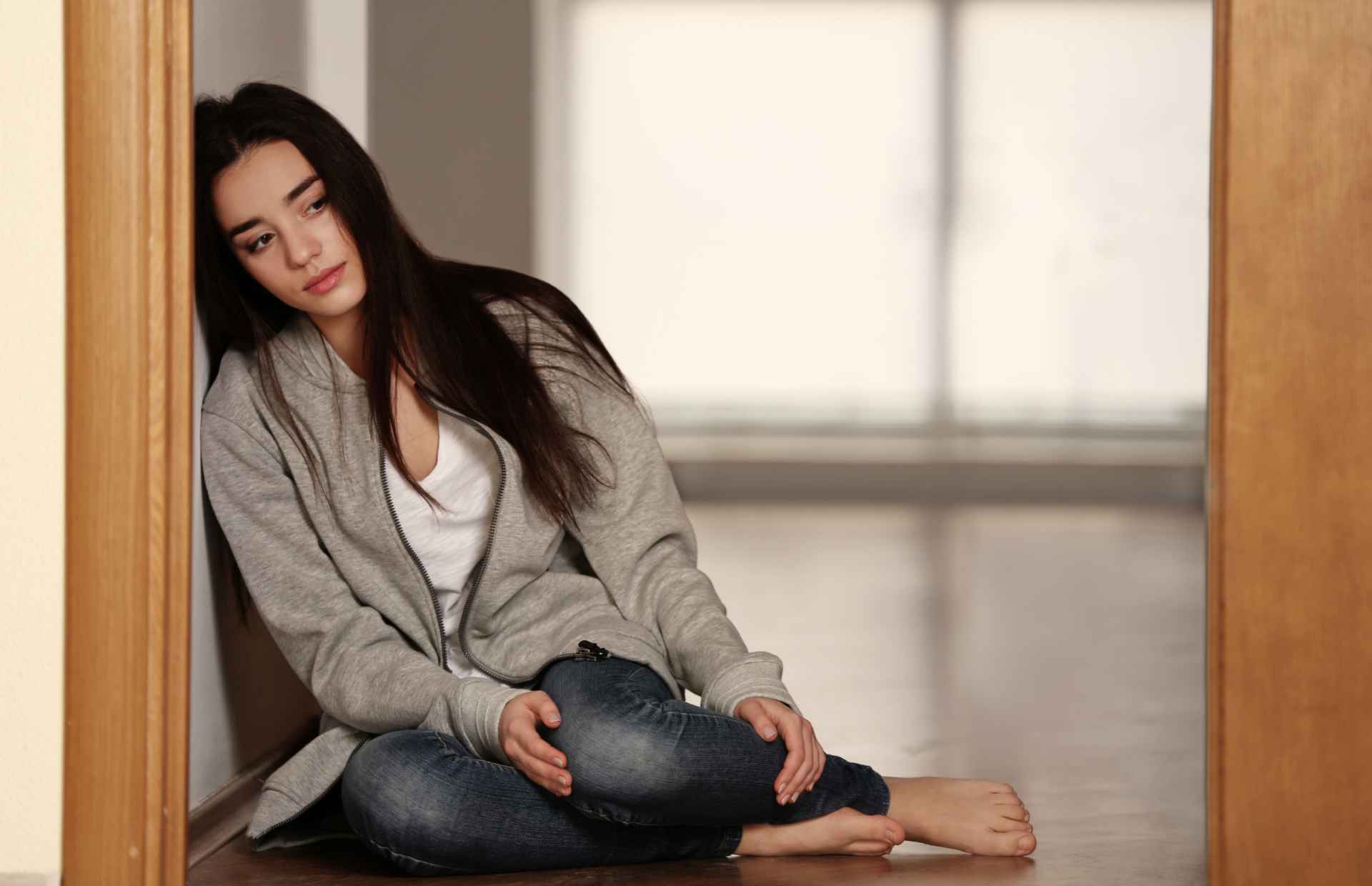 Depressed woman sitting alone
