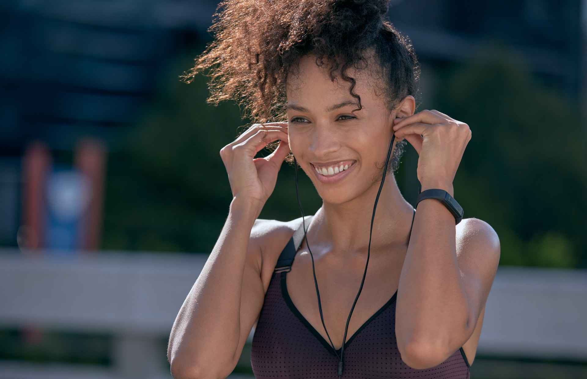 Woman smiling whilst walking
